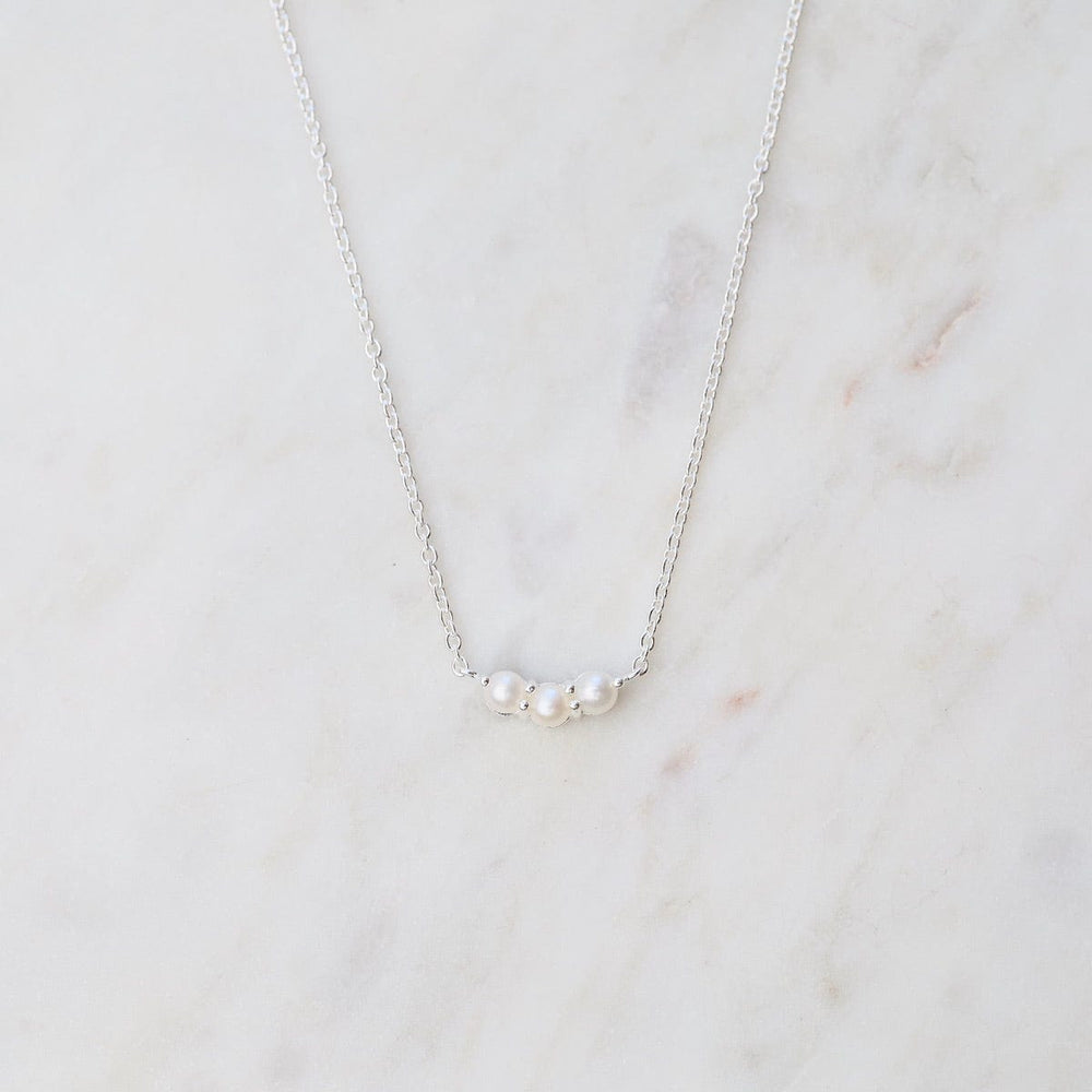 
                      
                        NKL Little Curve Necklace with Three White Freshwater Pearls
                      
                    