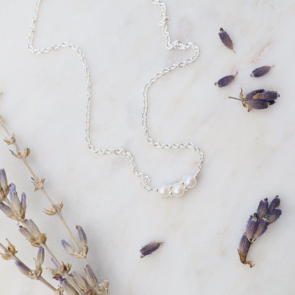 
                      
                        NKL Little Curve Necklace with Three White Freshwater Pearls
                      
                    