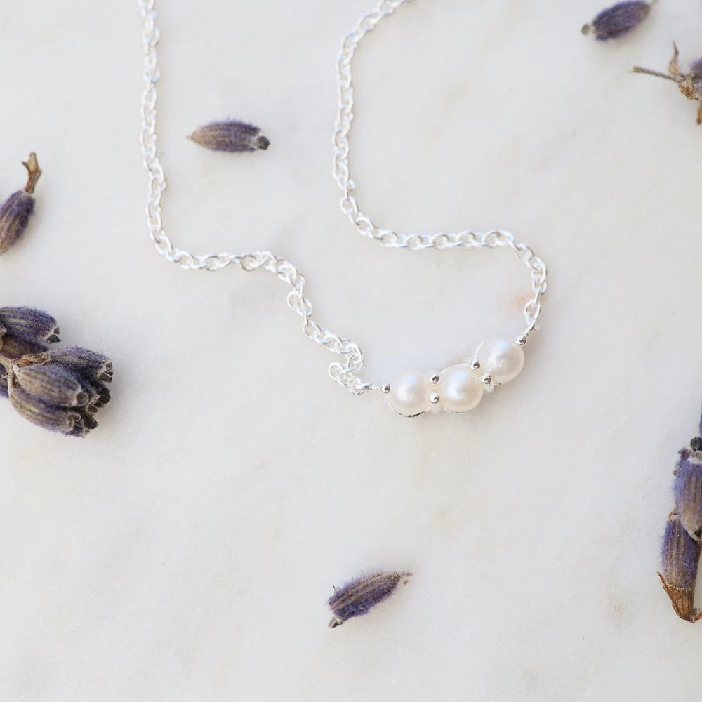 
                      
                        NKL Little Curve Necklace with Three White Freshwater Pearls
                      
                    