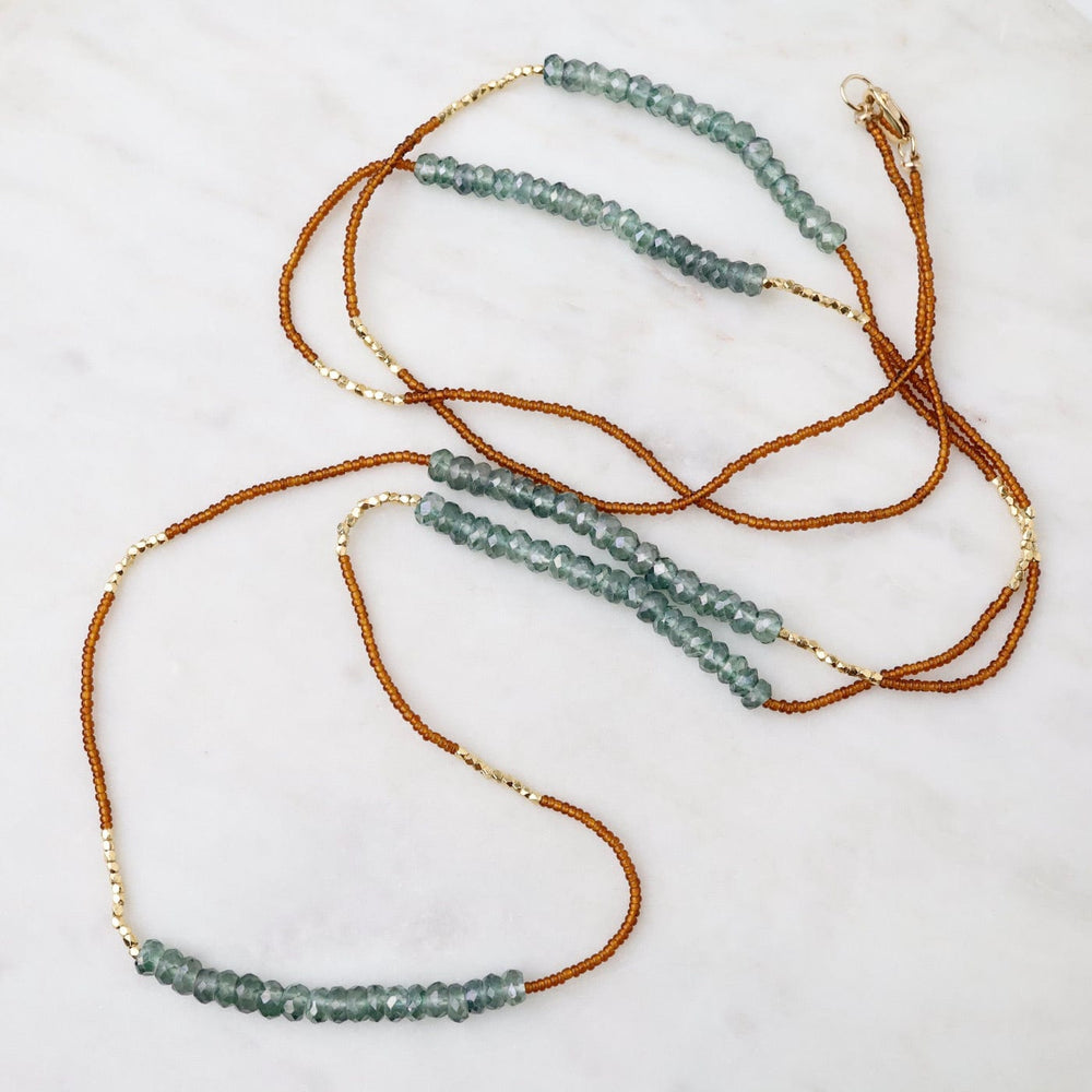 
                      
                        NKL Long Bronze Seed Bead Necklace
                      
                    