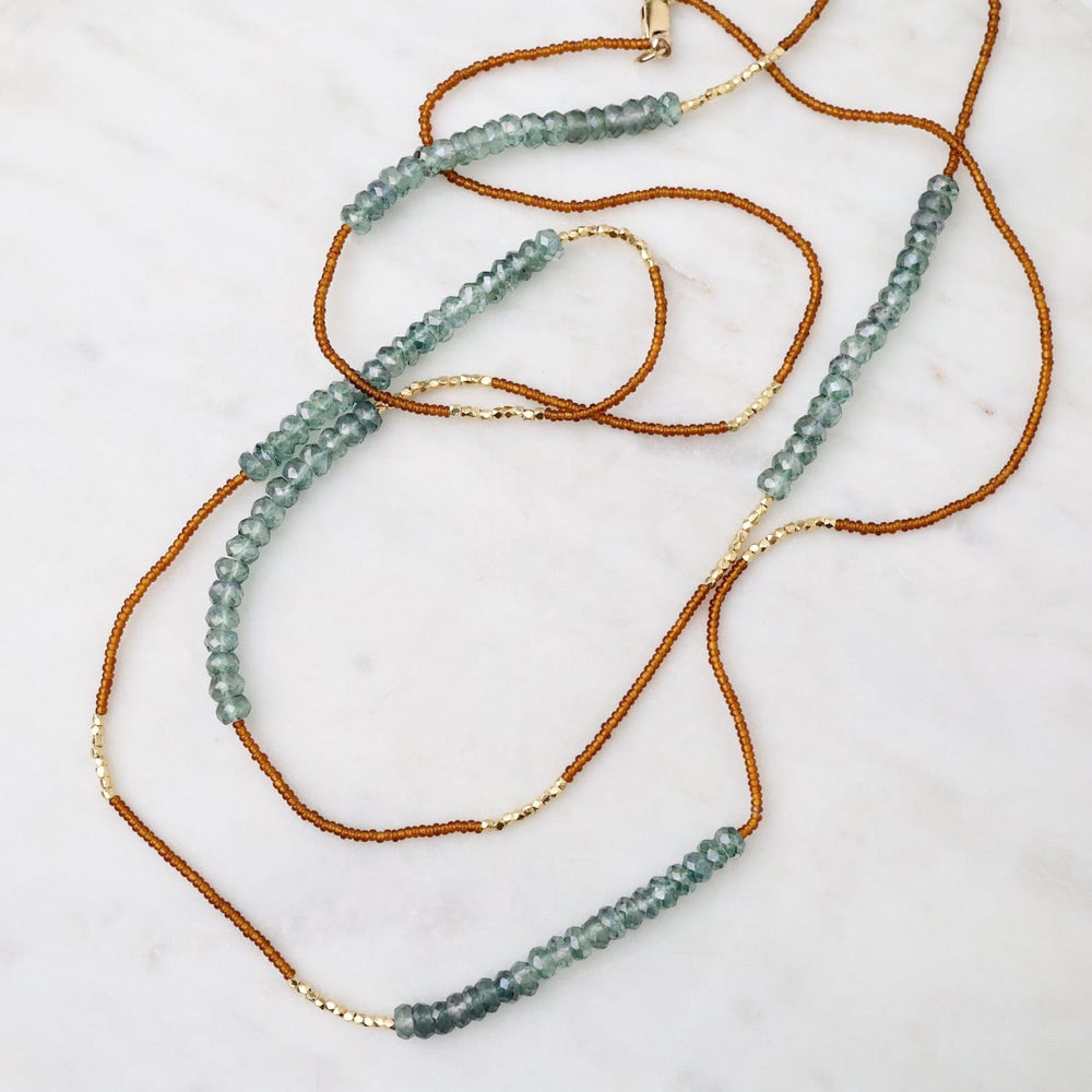 
                      
                        NKL Long Bronze Seed Bead Necklace
                      
                    