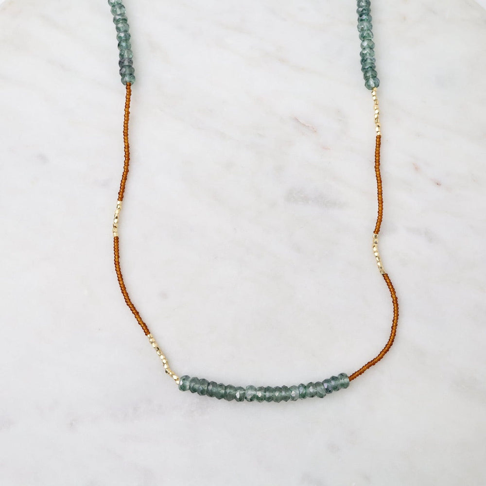 
                      
                        NKL Long Bronze Seed Bead Necklace
                      
                    