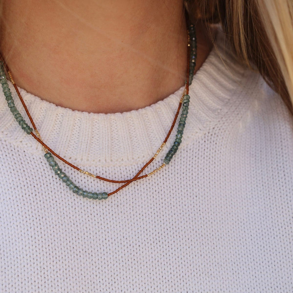 
                      
                        NKL Long Bronze Seed Bead Necklace
                      
                    