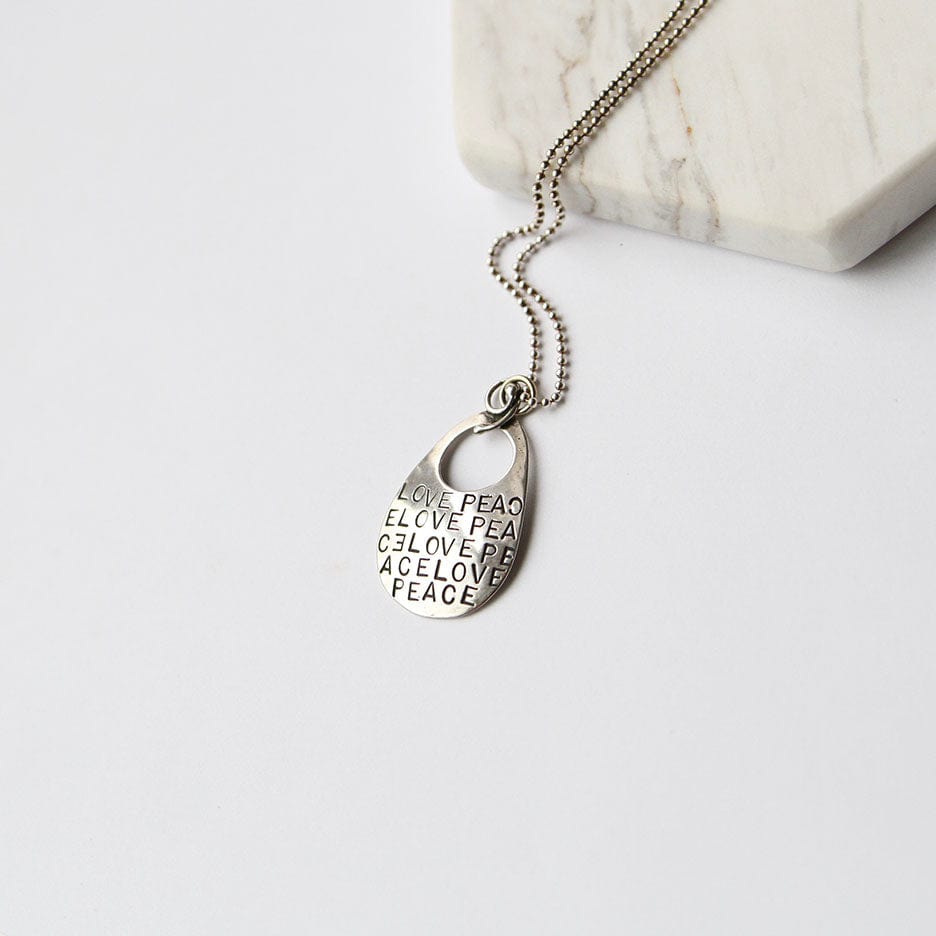 
                  
                    NKL "Love, Peace" Stamping Pendant
                  
                