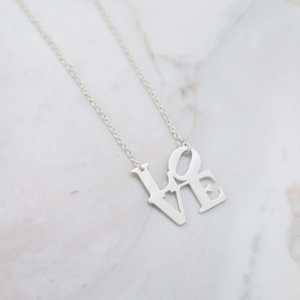 
                  
                    NKL Matte Silver Love Sculpture Necklace
                  
                