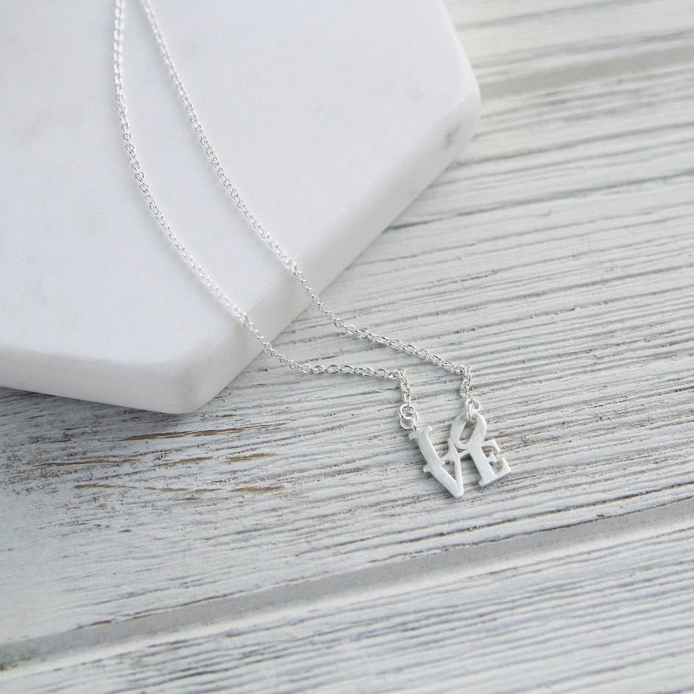 
                  
                    NKL Matte Silver Mini LOVE Sculpture Necklace
                  
                