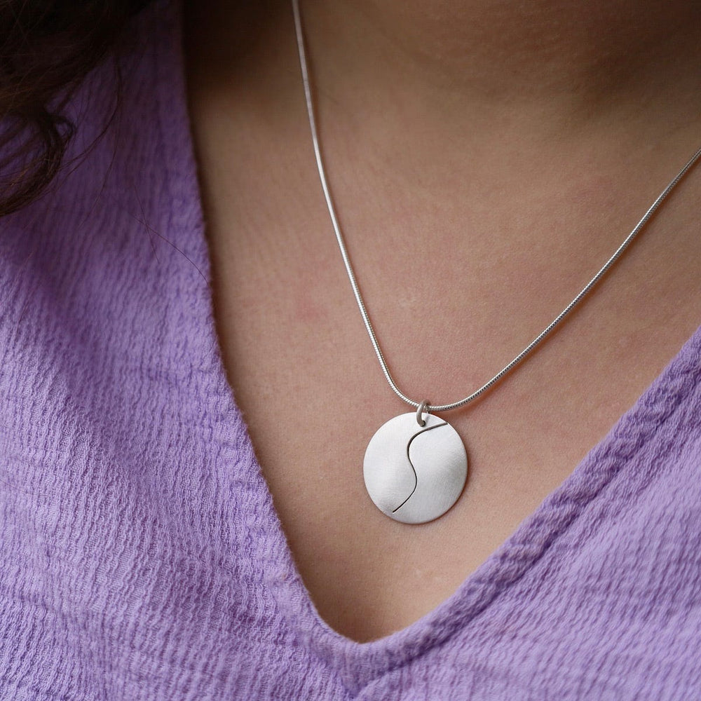 
                      
                        NKL Matte Silver Swirl Pendant Necklace
                      
                    