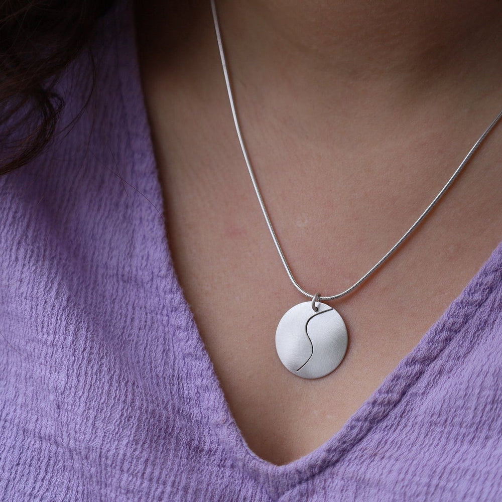 
                      
                        NKL Matte Silver Swirl Pendant Necklace
                      
                    