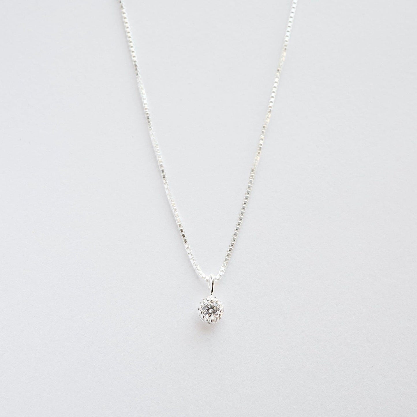 NKL Milgrain Edge Round CZ on Sterling Silver Box Chain