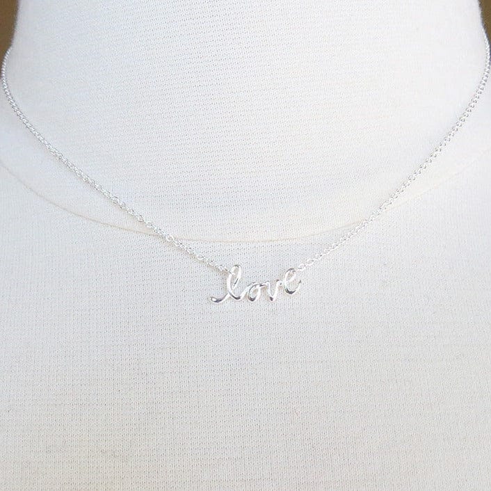 
                      
                        NKL Mini Cursive "love" Necklace
                      
                    