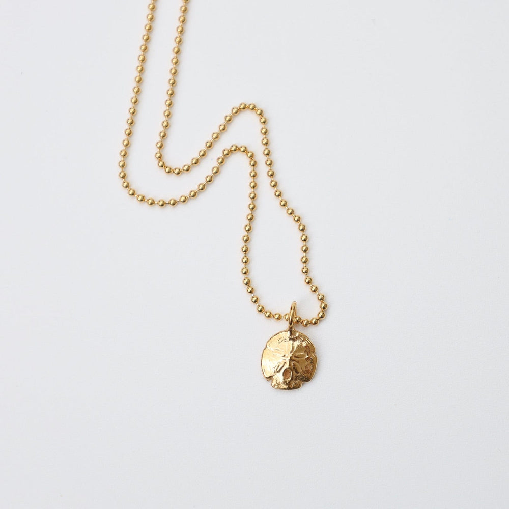 
                  
                    NKL Mini Sand Dollar Necklace in 18k Gold Vermeil
                  
                