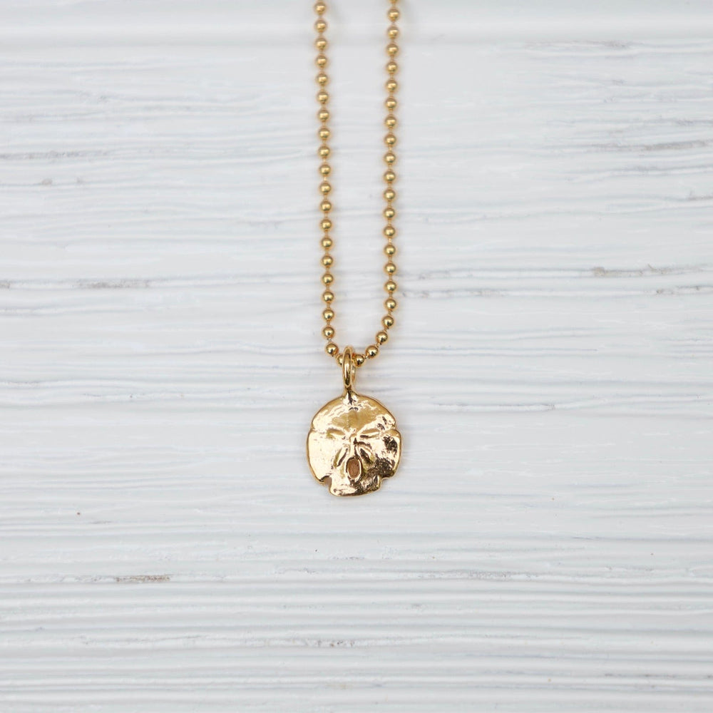 
                  
                    NKL Mini Sand Dollar Necklace in 18k Gold Vermeil
                  
                