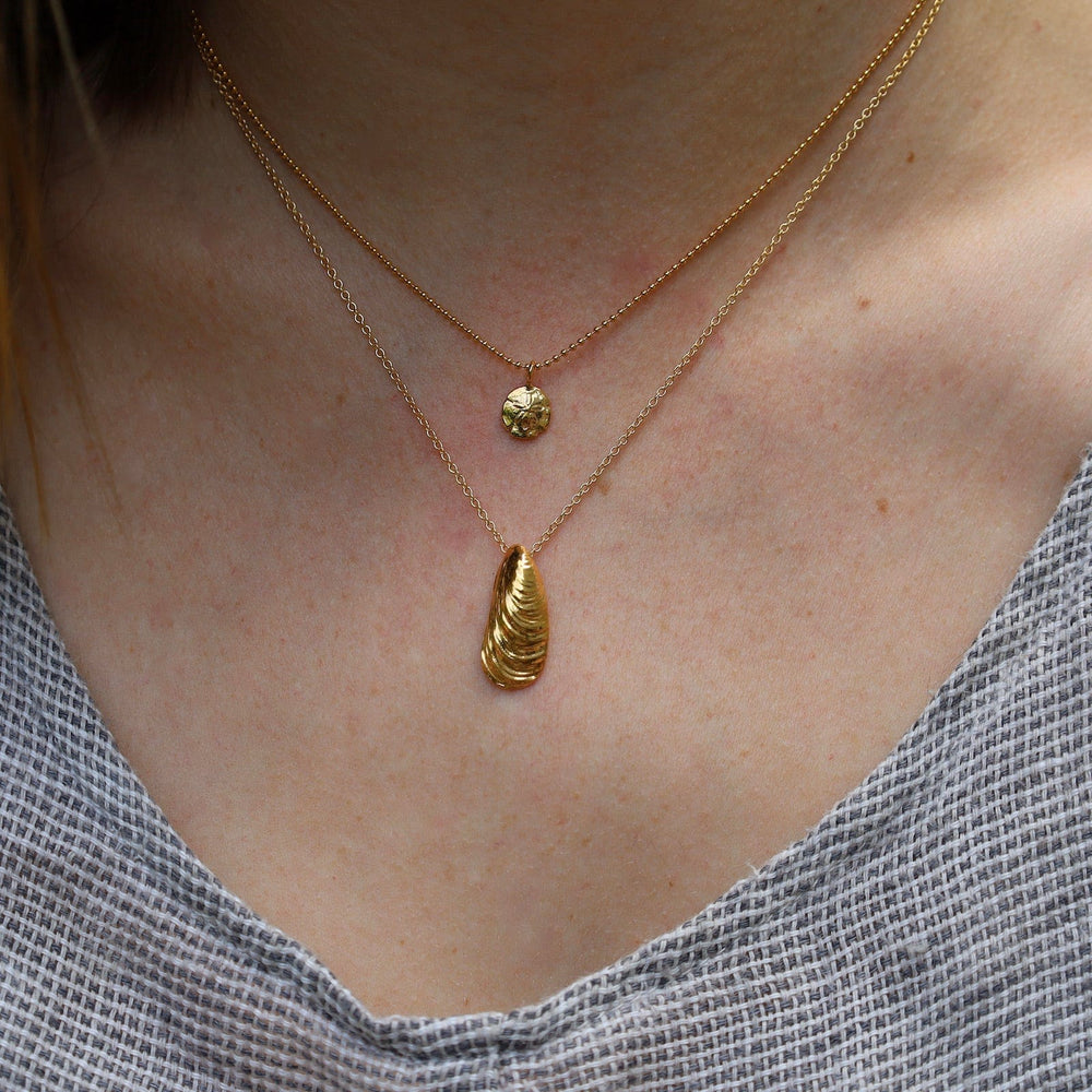 
                  
                    NKL Mini Sand Dollar Necklace in 18k Gold Vermeil
                  
                