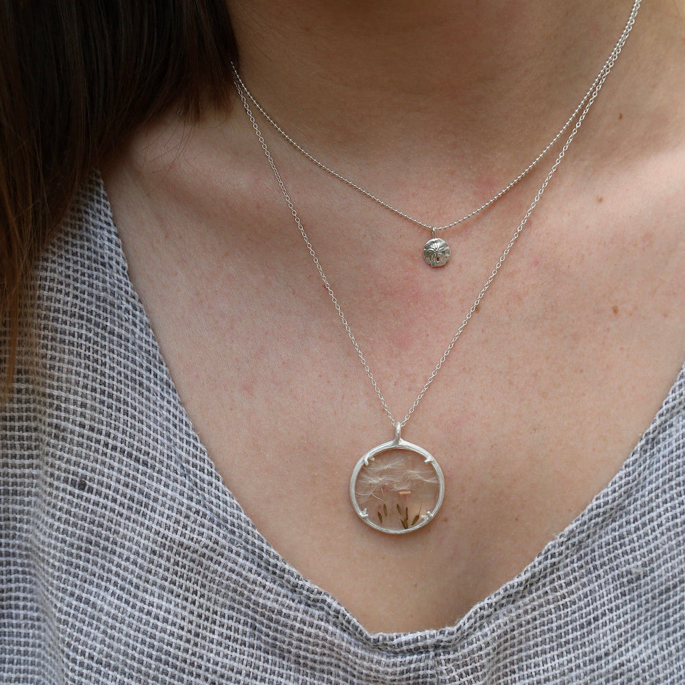 
                      
                        NKL Mini Sand Dollar Necklace in Sterling Silver
                      
                    