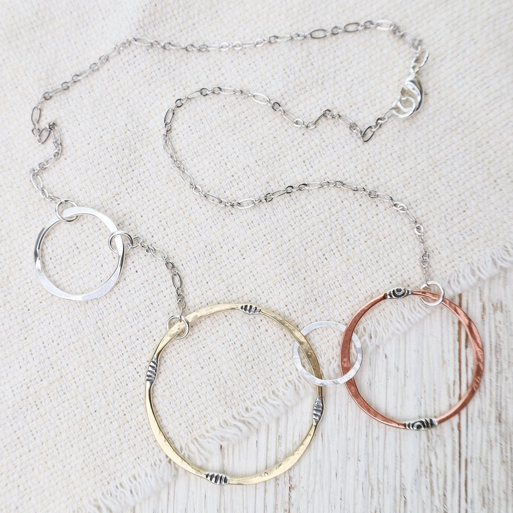 
                  
                    NKL Mixed Metals Random Circles Necklace
                  
                