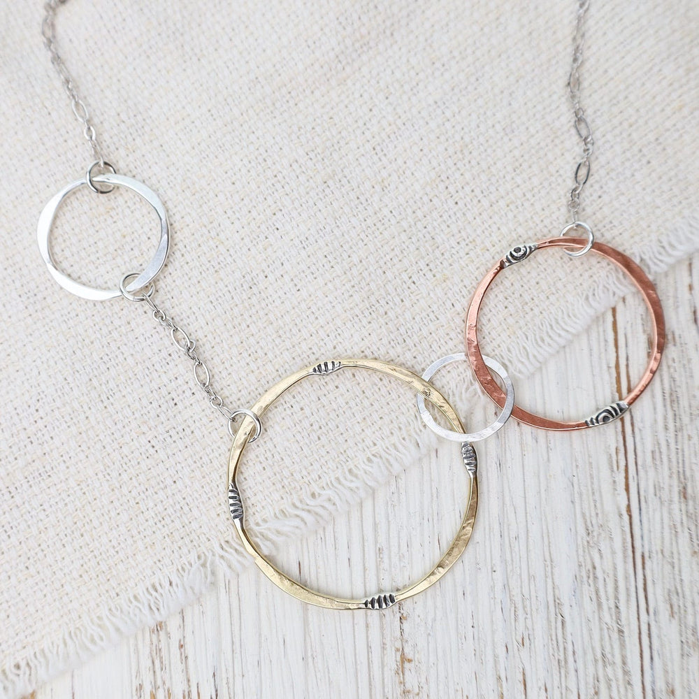 
                  
                    NKL Mixed Metals Random Circles Necklace
                  
                