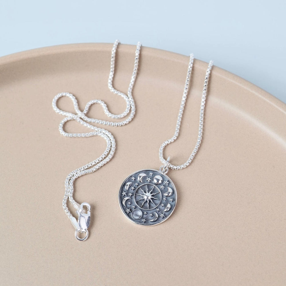 
                  
                    NKL Moon Phase Disc Pendant Necklace
                  
                