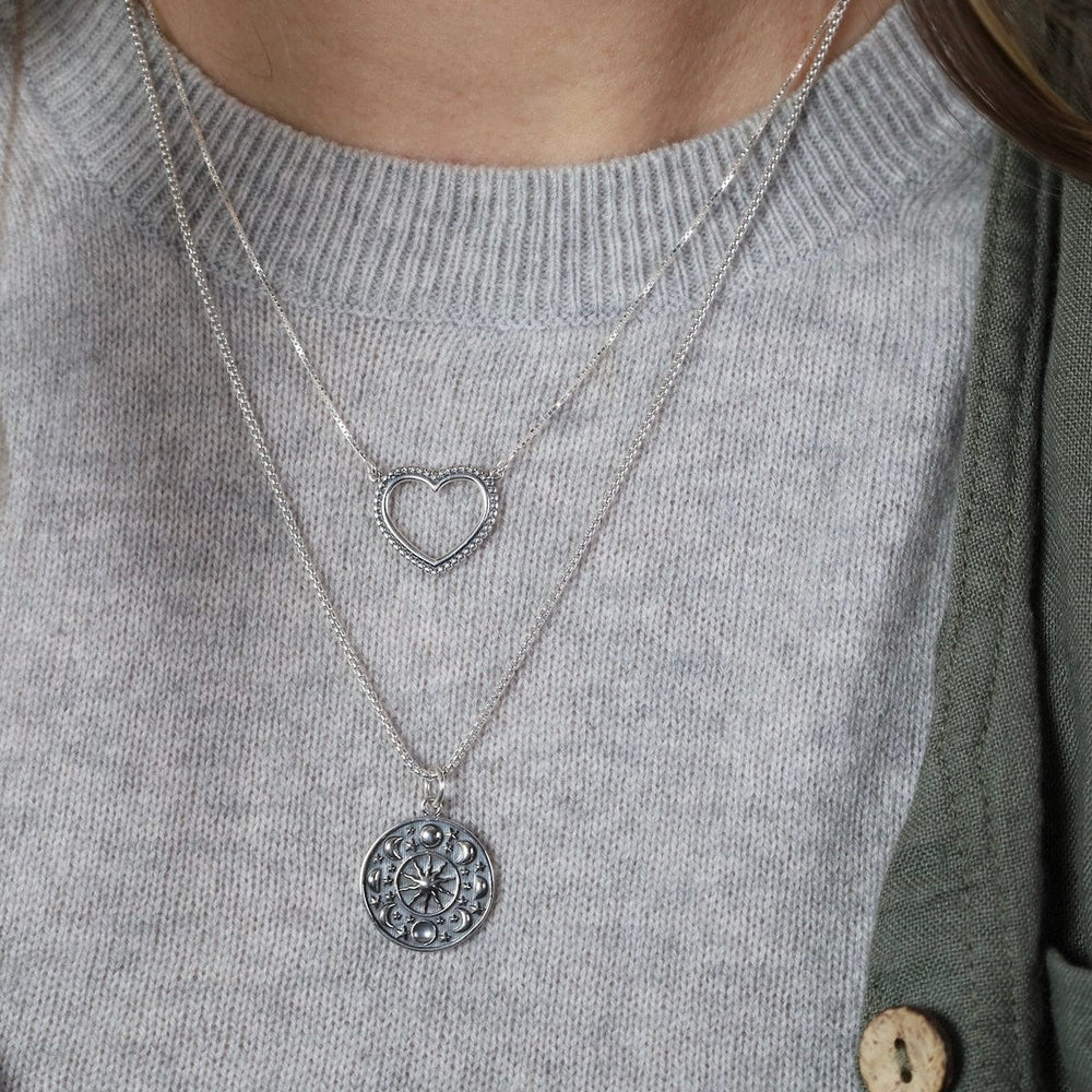 
                  
                    NKL Moon Phase Disc Pendant Necklace
                  
                