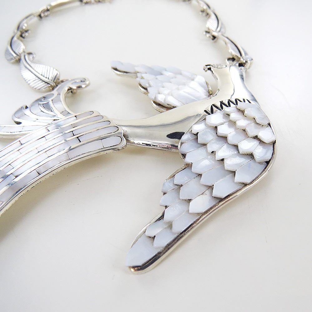 
                      
                        NKL MOTHER OF PEARL DOVE NECKLACE
                      
                    