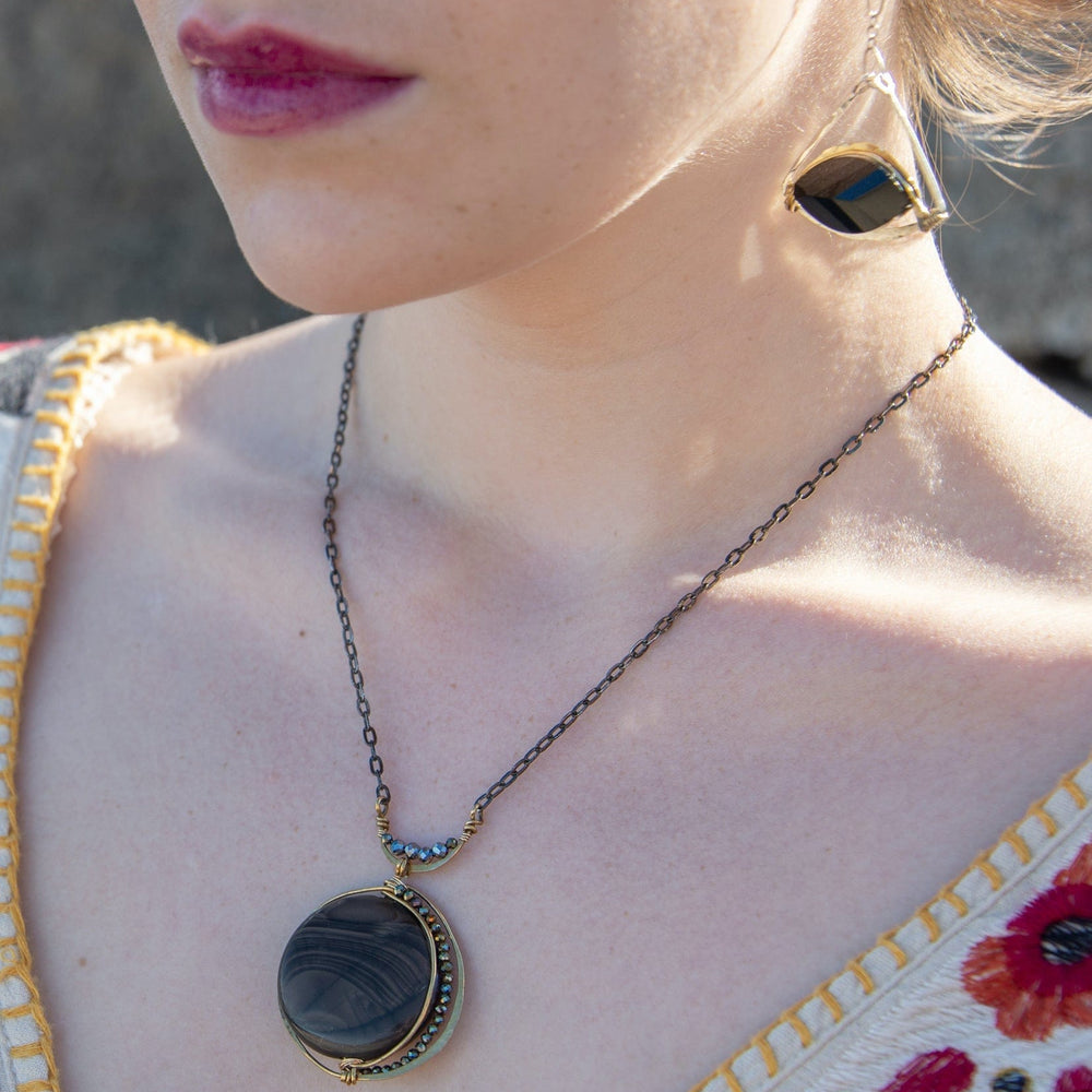 
                      
                        NKL New Moon Necklace
                      
                    