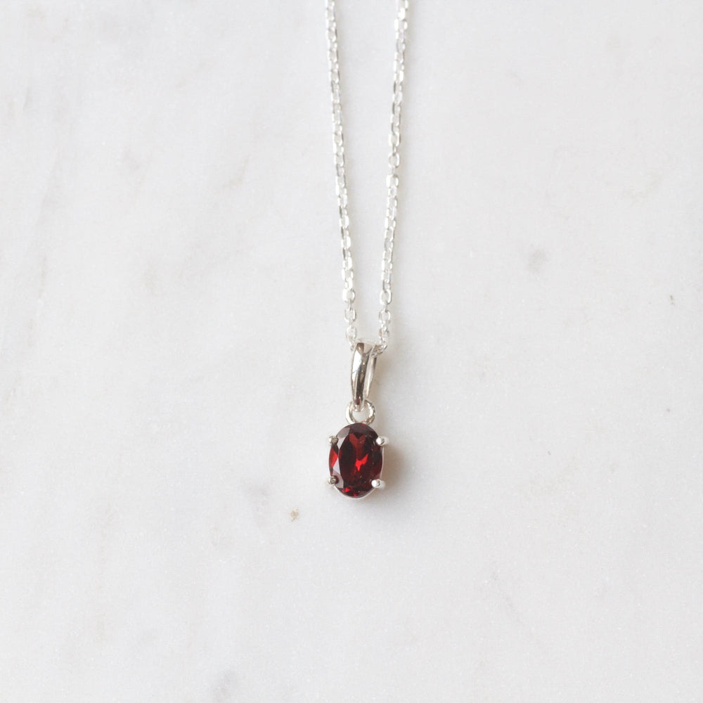 
                      
                        NKL Oval African Garnet Pendant
                      
                    