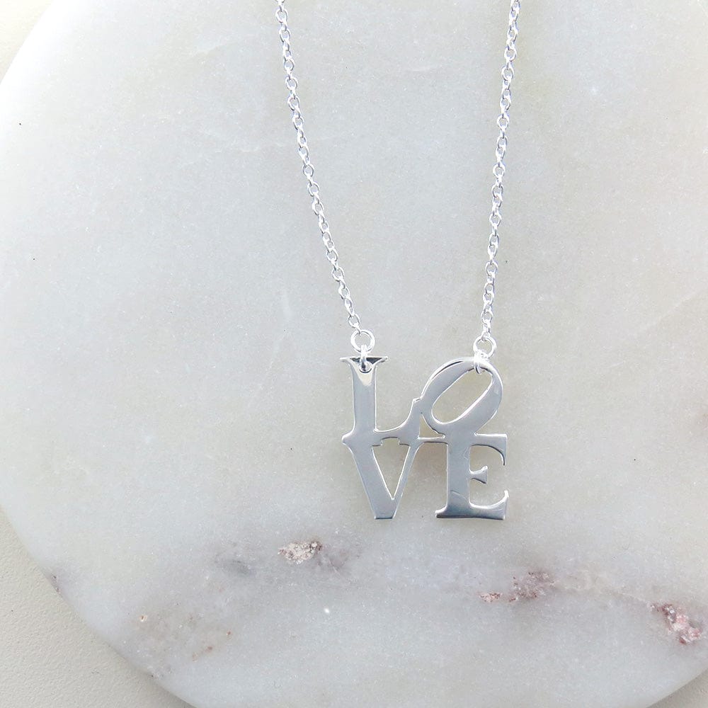 
                      
                        NKL Polished Silver LOVE Sculpture Necklace
                      
                    