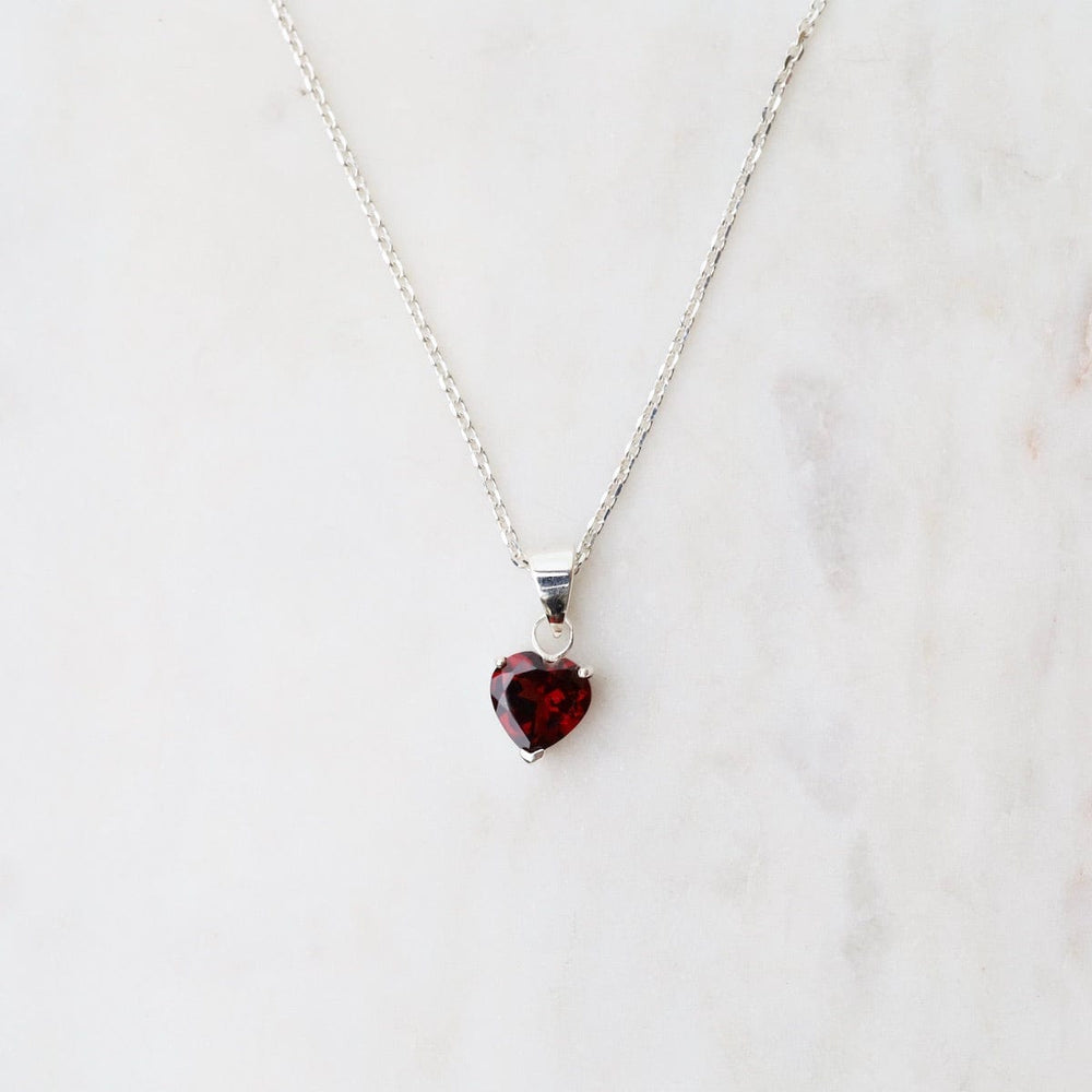 
                      
                        NKL Prong Set African Garnet Heart Pendant
                      
                    