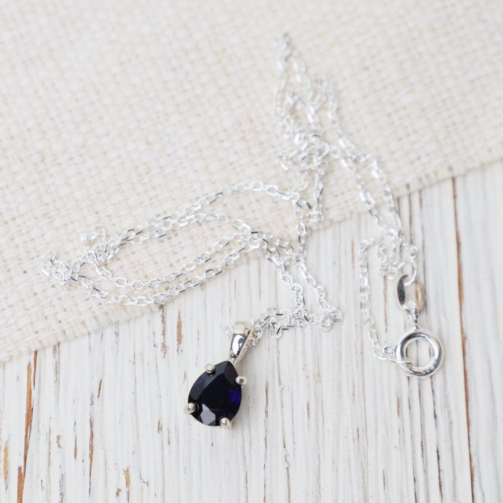 
                      
                        NKL Prong Set Pear Shaped Synthetic Sapphire Pendant Necklace
                      
                    