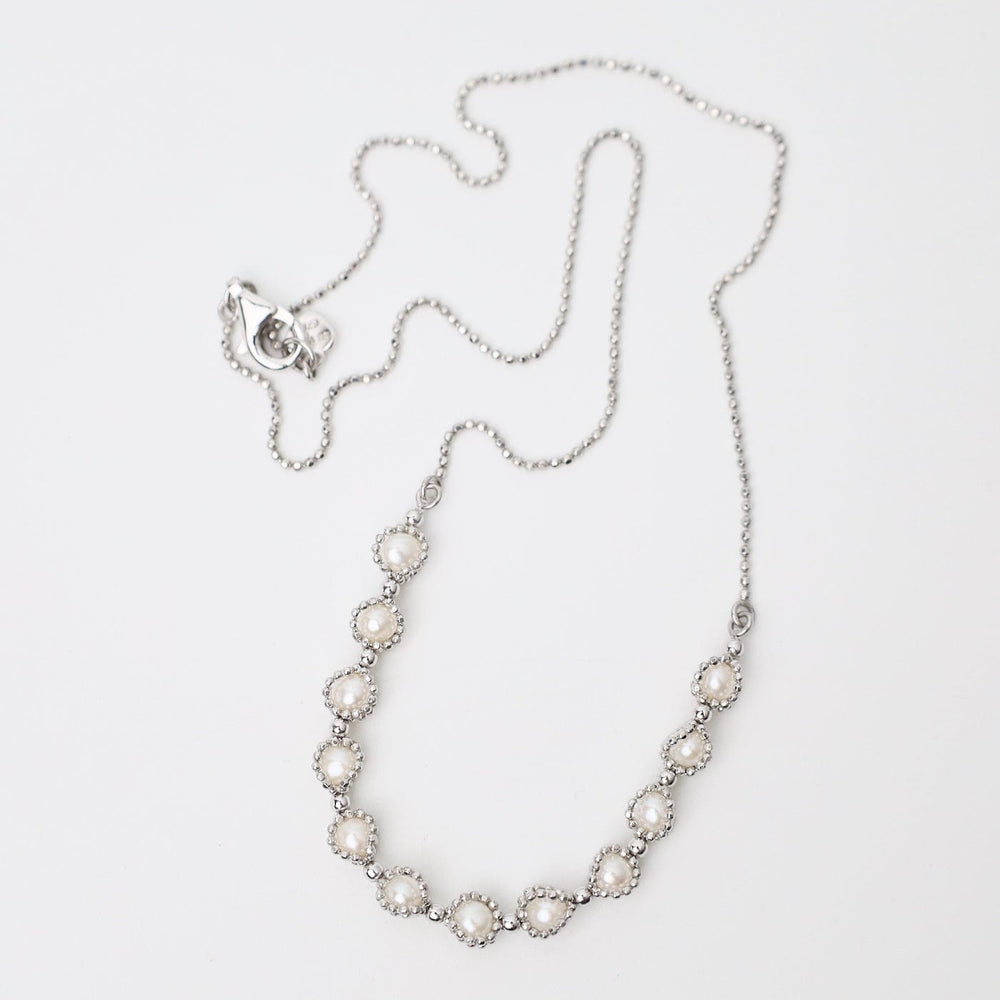 
                  
                    NKL Rhodium Plated Sterling 12 Captured Pearls Necklace
                  
                