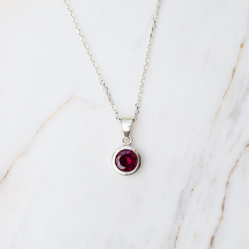 
                      
                        NKL Rhodolite Garnet Dot Pendant
                      
                    