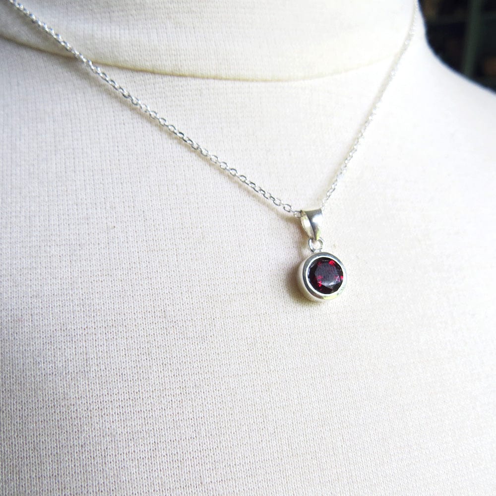 
                      
                        NKL Round African Garnet Pendant
                      
                    