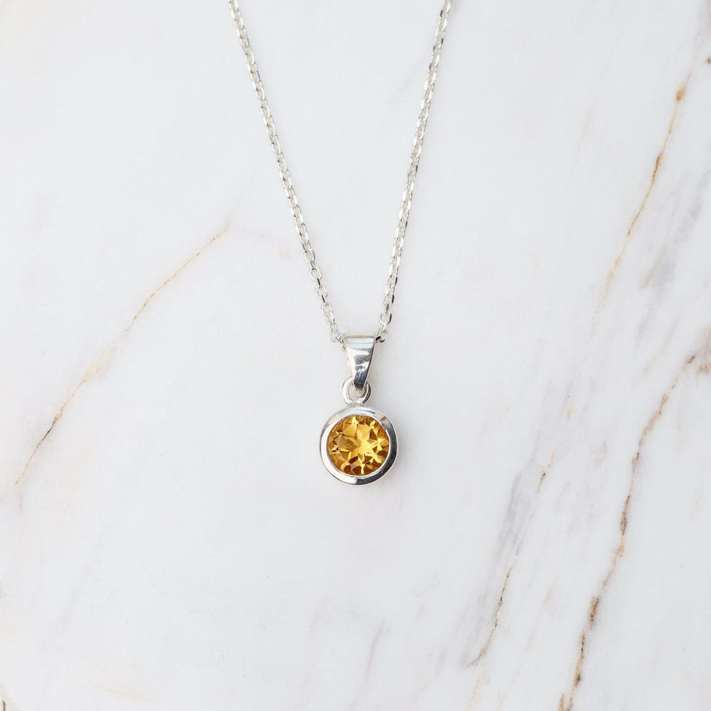 
                      
                        NKL Round Citrine Pendant
                      
                    