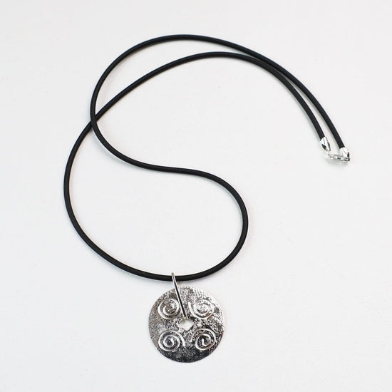 NKL Round Disc Pendant with Swirls on Black Cord