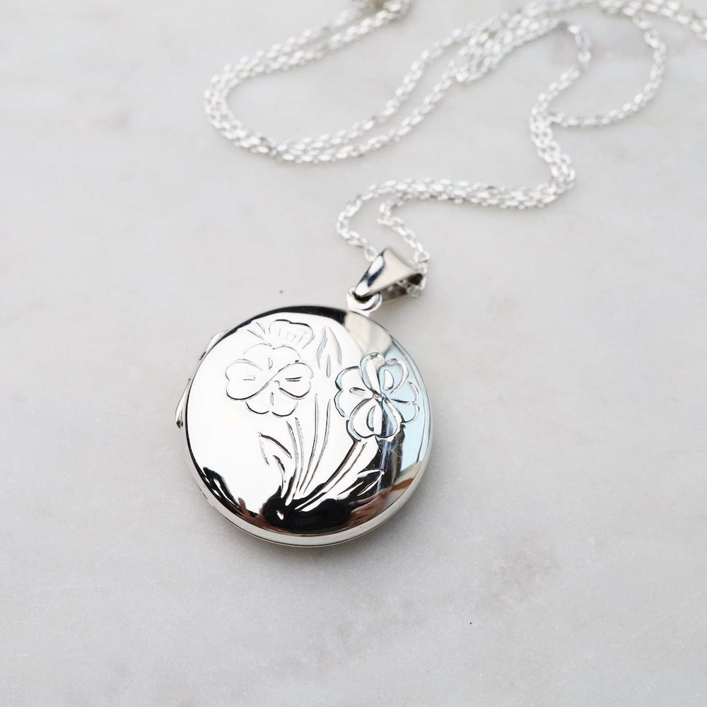 
                  
                    NKL Round Locket Necklace with Floral Details
                  
                