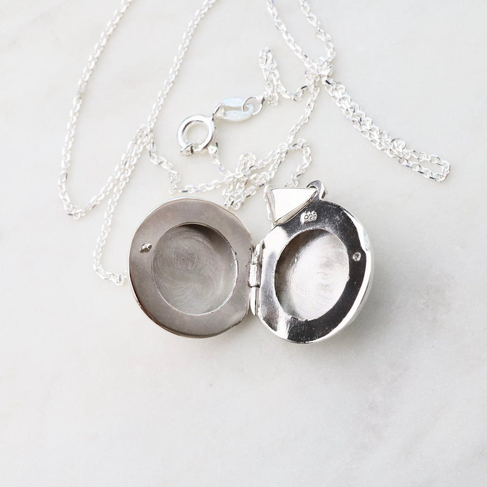 
                  
                    NKL Round Locket Necklace with Vine Details
                  
                