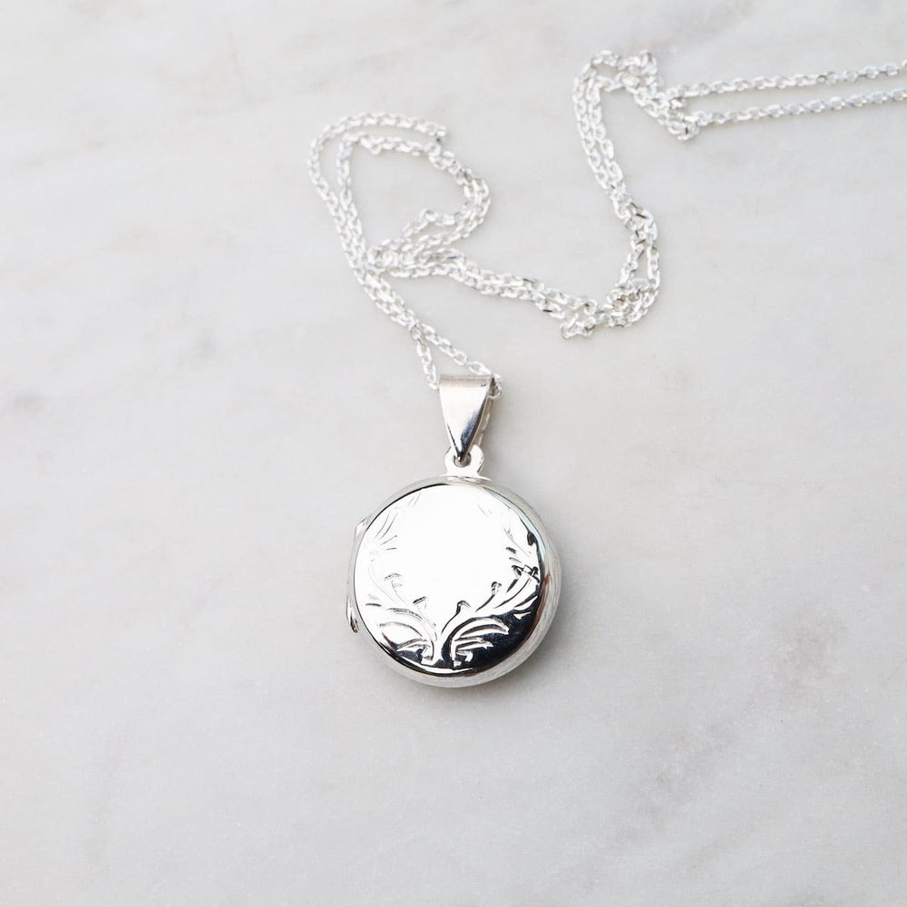 
                  
                    NKL Round Locket Necklace with Vine Details
                  
                