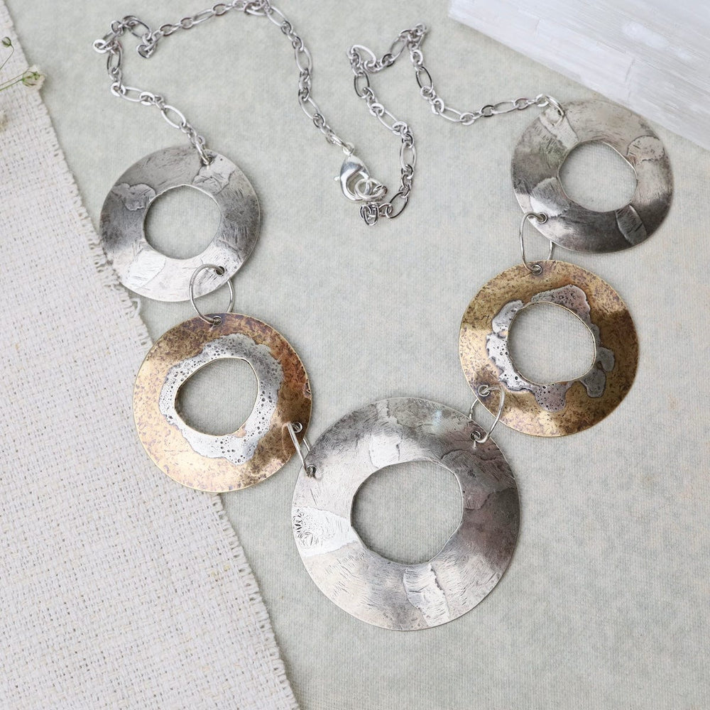 
                  
                    NKL Rugged Circles Necklace
                  
                