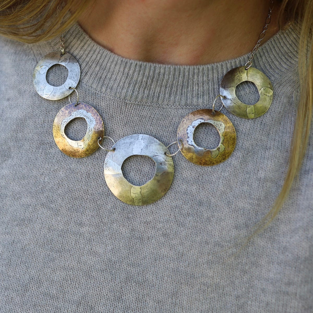 
                  
                    NKL Rugged Circles Necklace
                  
                