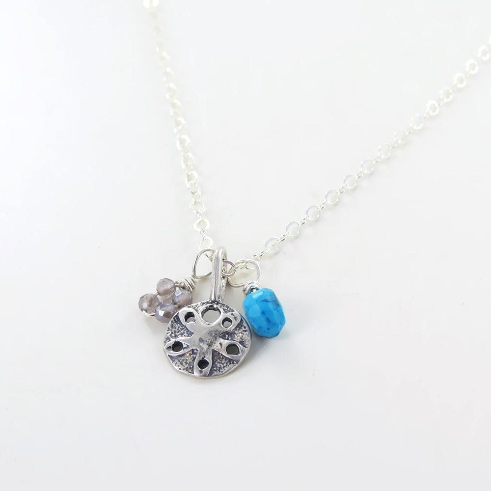 
                      
                        NKL SANDDOLLAR NECKLACE
                      
                    