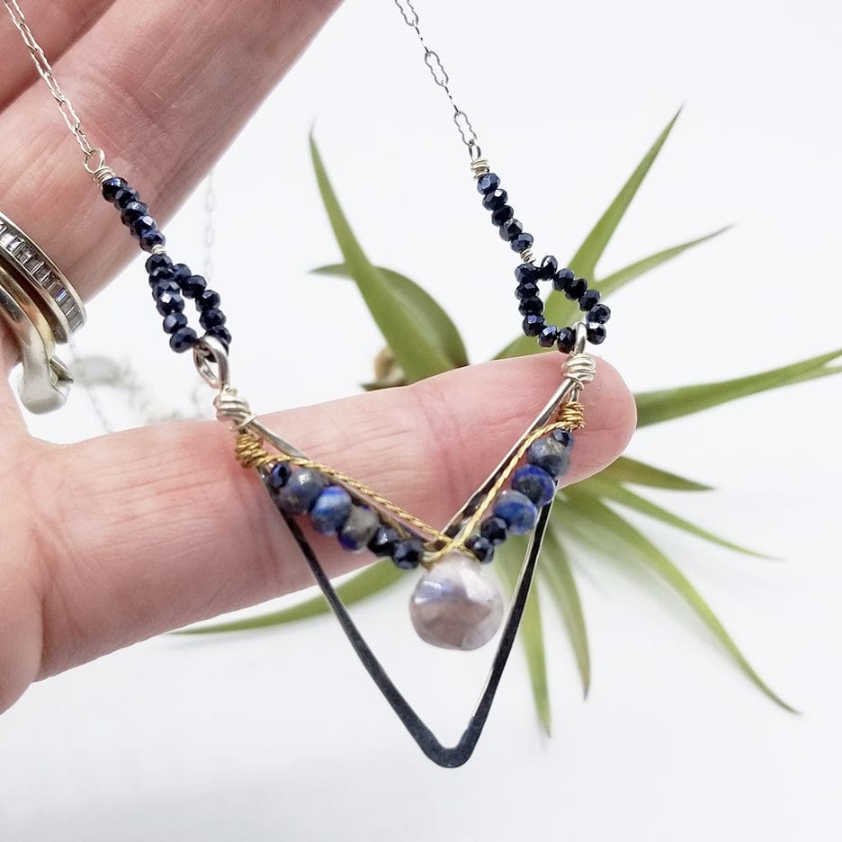 
                  
                    NKL SAPPHITE DROP IN LAPIS AND PYRITE IN HAND FORMED STERLING SILVER CHEVRON
                  
                