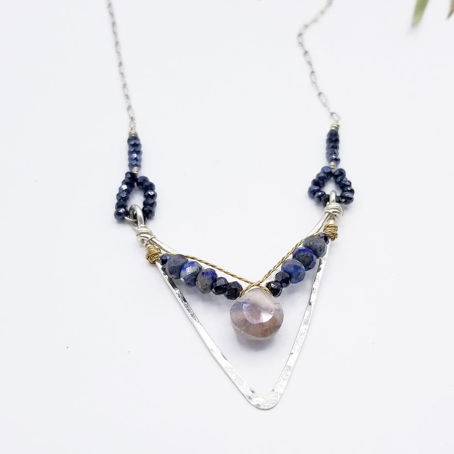 
                  
                    NKL SAPPHITE DROP IN LAPIS AND PYRITE IN HAND FORMED STERLING SILVER CHEVRON
                  
                