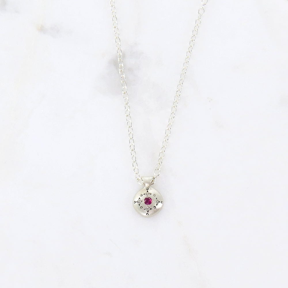 
                  
                    NKL Silver Lights Charm Pendant with Ruby
                  
                