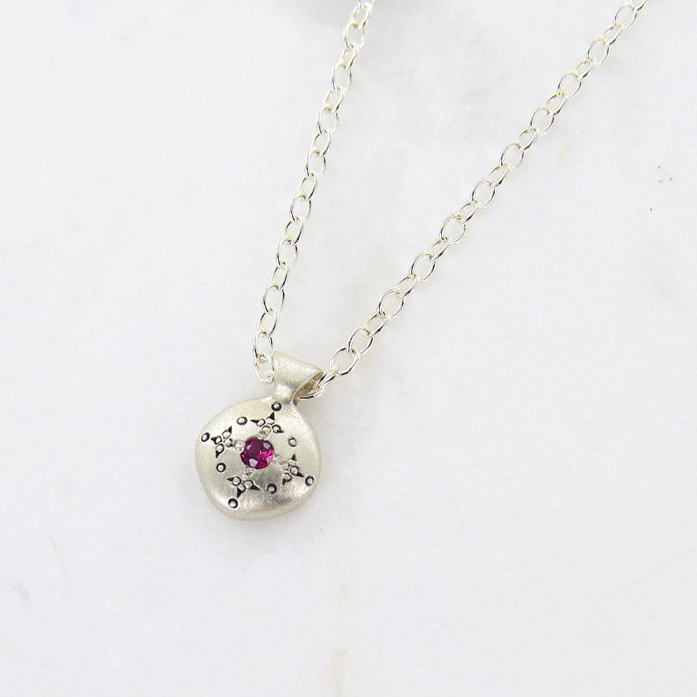 
                  
                    NKL Silver Lights Charm Pendant with Ruby
                  
                