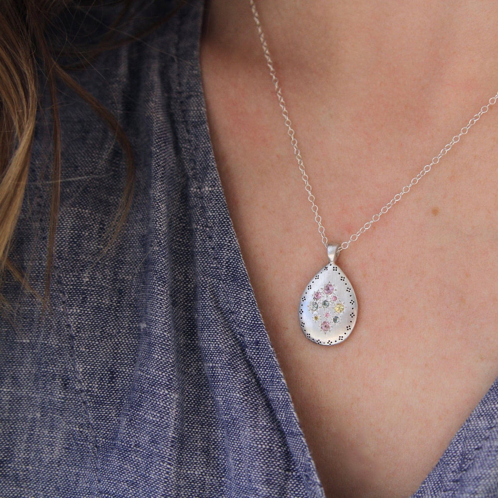 
                      
                        NKL Silver Lights Teardrop Pendant in Multi Sapphire
                      
                    