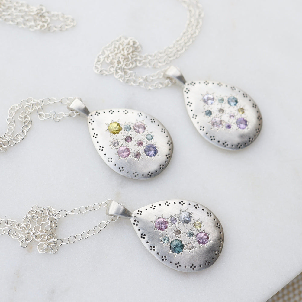 
                      
                        NKL Silver Lights Teardrop Pendant in Multi Sapphire
                      
                    