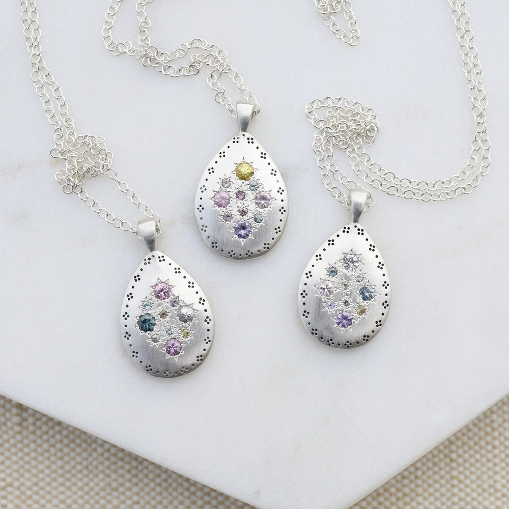 
                      
                        NKL Silver Lights Teardrop Pendant in Multi Sapphire
                      
                    