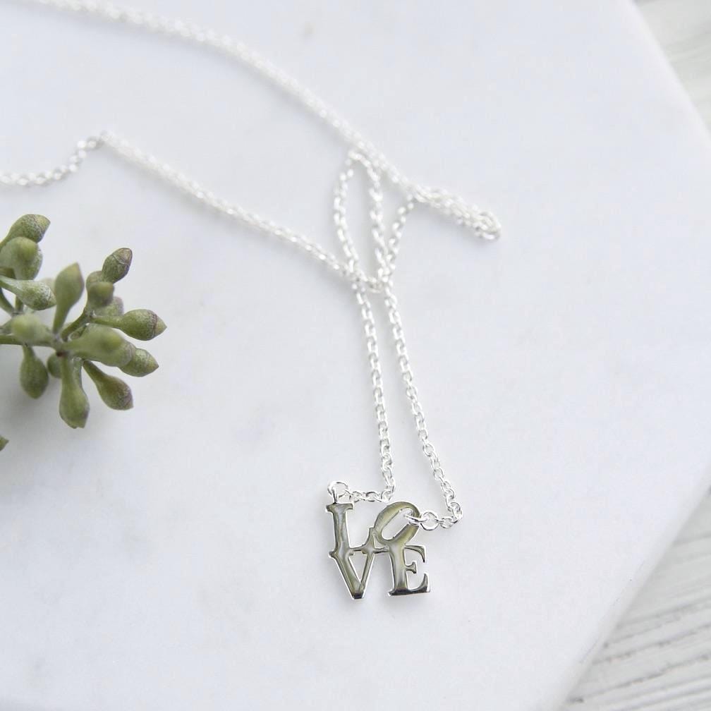 NKL Silver Polished Mini LOVE Sculpture Necklace