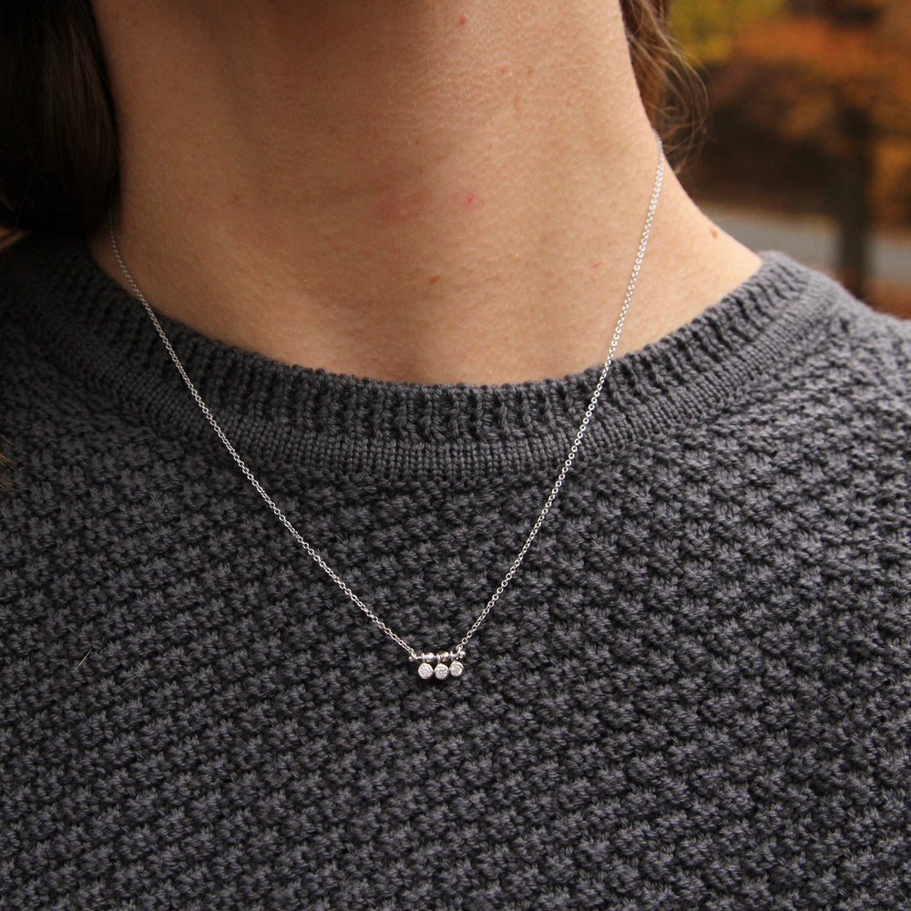 
                      
                        NKL Silver Shimmer Triple Stud Necklace
                      
                    