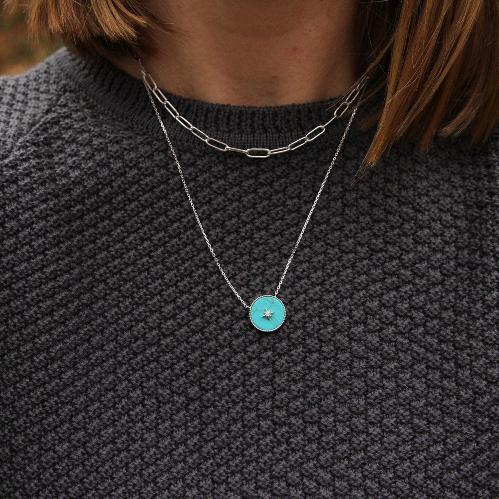 
                  
                    NKL Silver Turquoise Emblem Necklace
                  
                