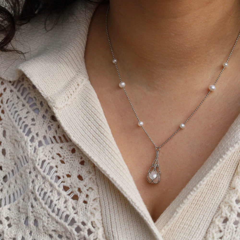 
                      
                        NKL Simple Pearl Stations with Captured White Pearl Necklace
                      
                    